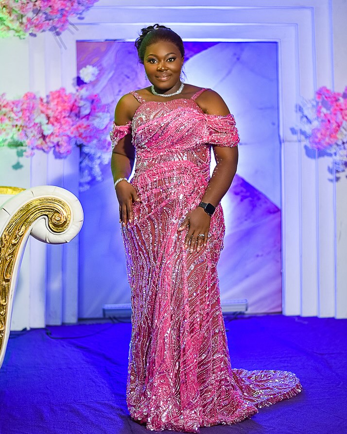 Sequin pink evening gown, floor-sweeping train.